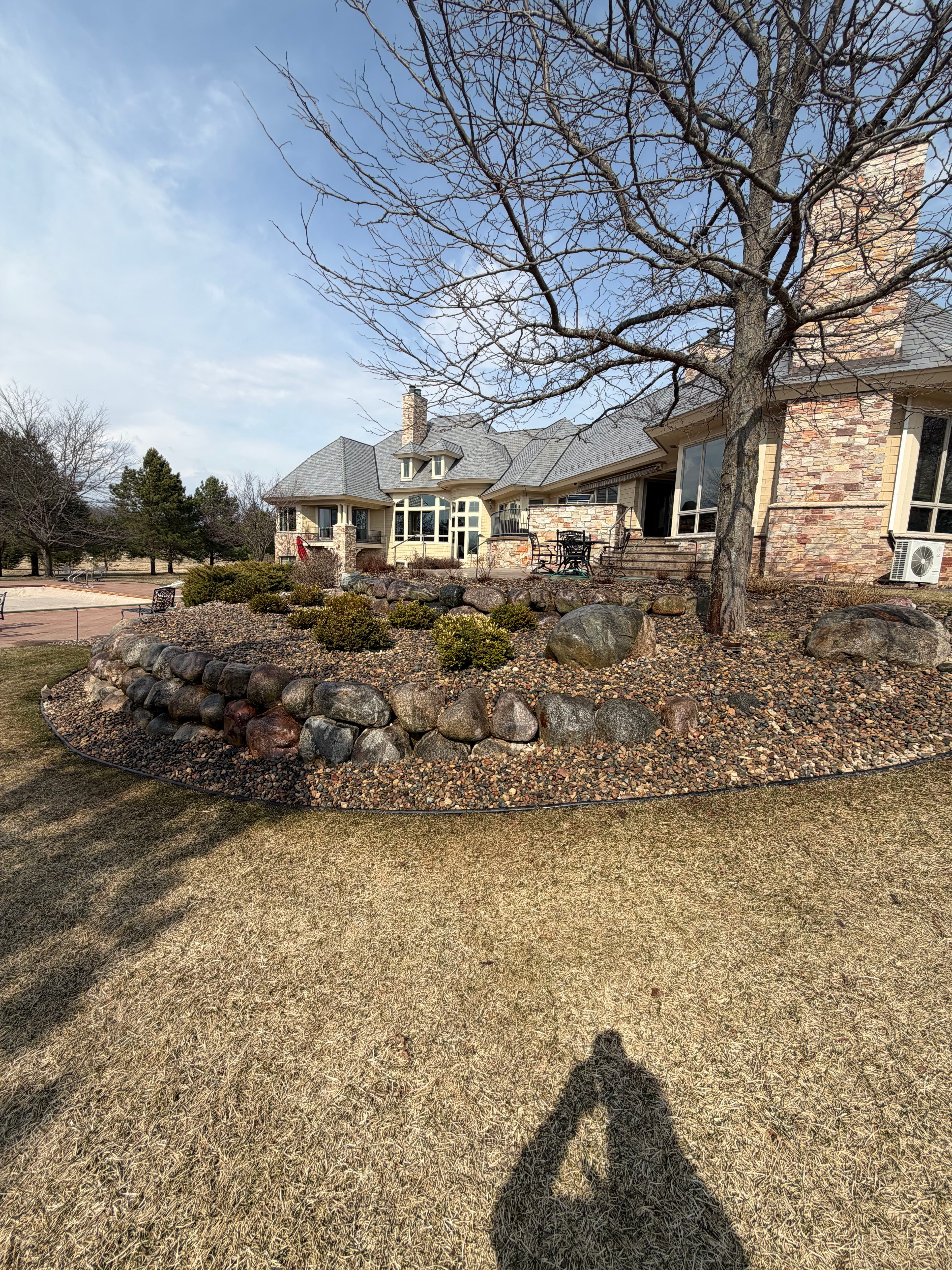 Project River Rock Bed Refresh with Clean Edging and Drip Irrigation image